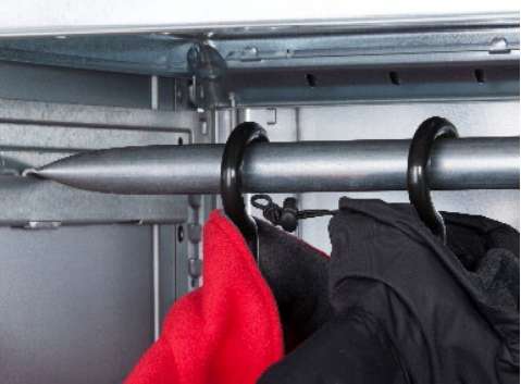 Dexion HI280 garment rail installed on HI280 shelving with coats on hangers