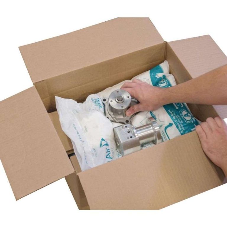 Instapak Quick expanding foam packaging bags cushioning a metal component inside a cardboard shipping box