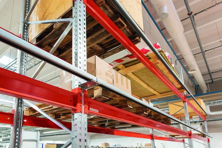 Pallet racking back stop tube installed at the rear of a pallet rack to prevent push-through