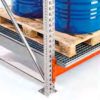 Beam-mounted pallet racking spill tray on rack beams under palletised drums