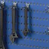 R3 tool hooks holding spanners on a blue perforated tool panel