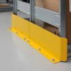 Yellow steel shelving end frame protector bolted to warehouse floor