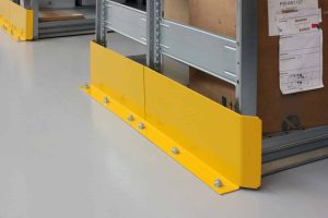 Yellow steel shelving end frame protector bolted to warehouse floor